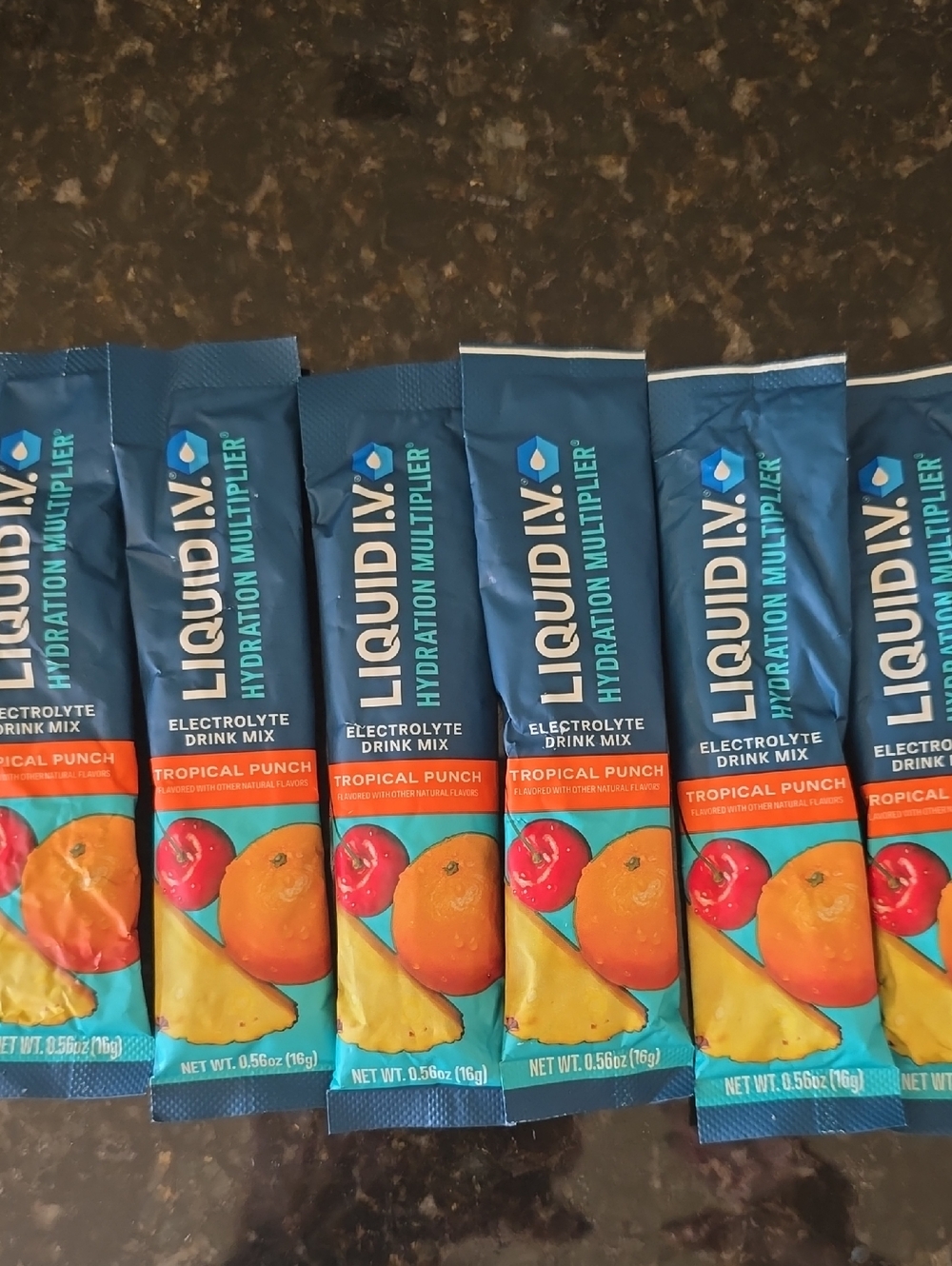 LIQUID IV Tropical Punch Hydration Drink Mix - Single Serve Sticks (Blue/Orange)